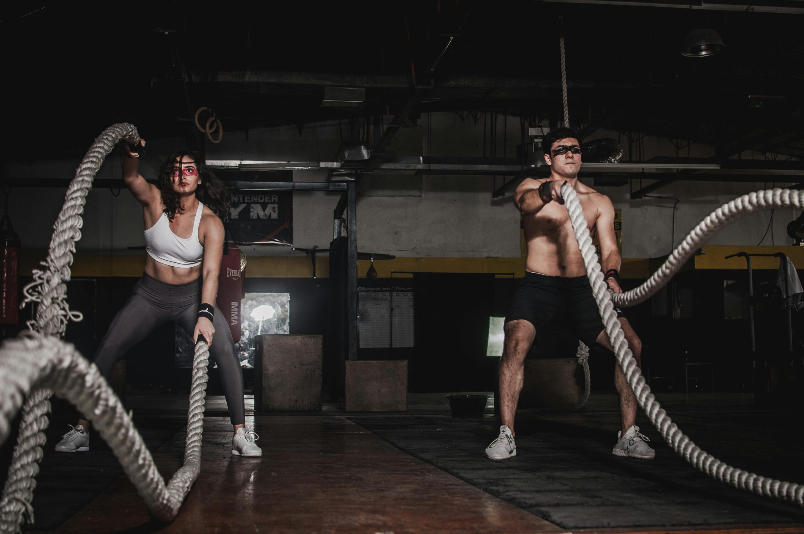 People using battle ropes as part of a balanced and sustainable workout routine.
